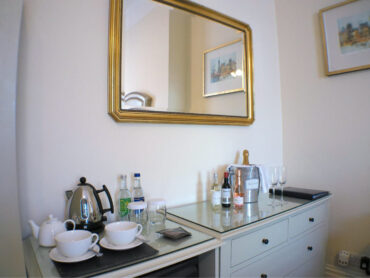 mini bar with alcoholic and soft drinks complimentary water tea and coffee making facility